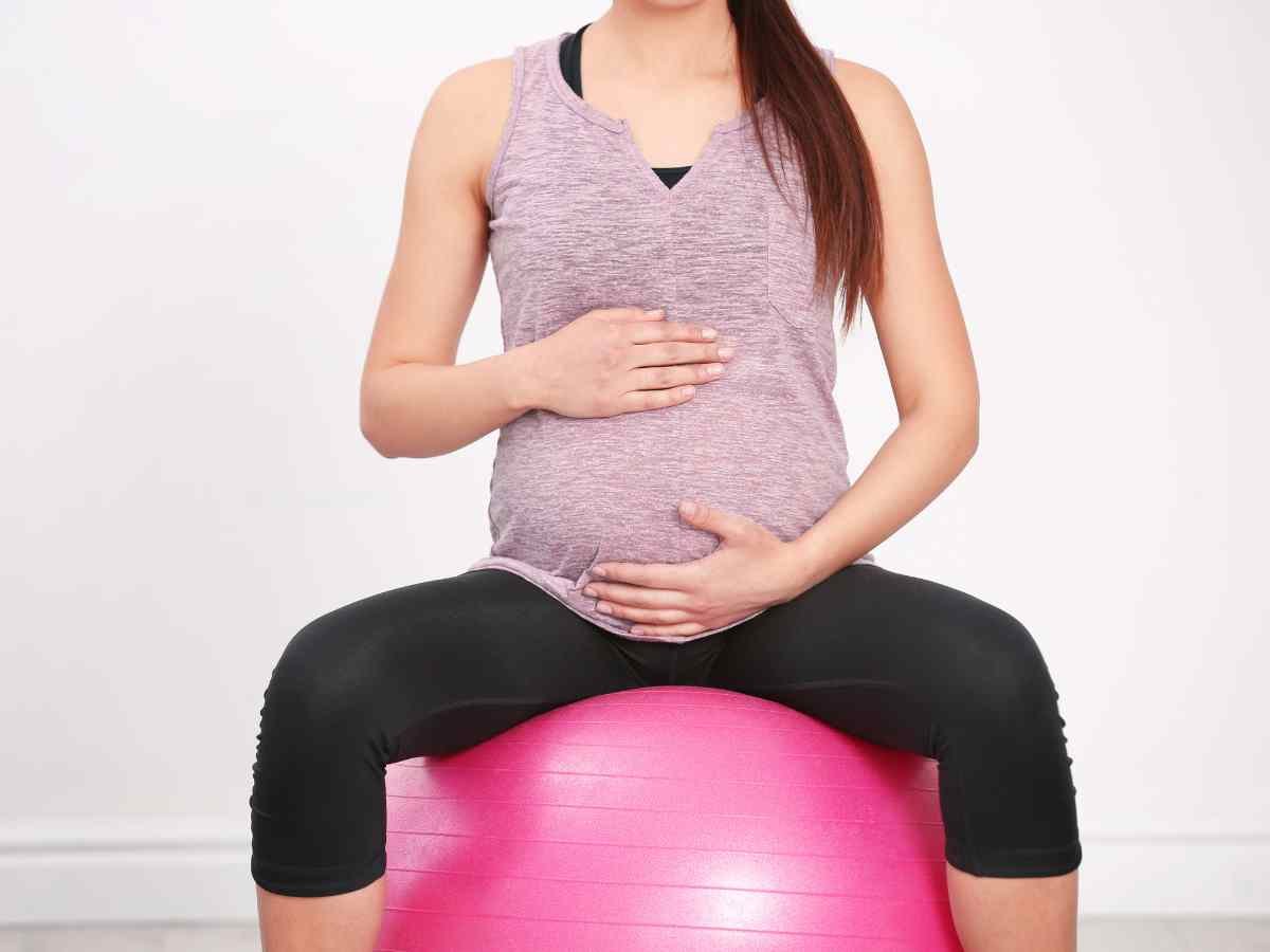 picture of pregnant woman sitting on an exercise ball.